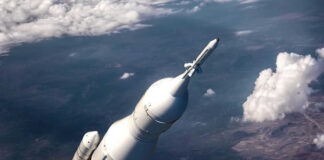Rocket launching above the Earth.