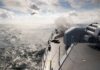 Hormuz Boils—Ceasefire On Life Support Naval ship firing a weapon into the ocean with a plane flying overhead