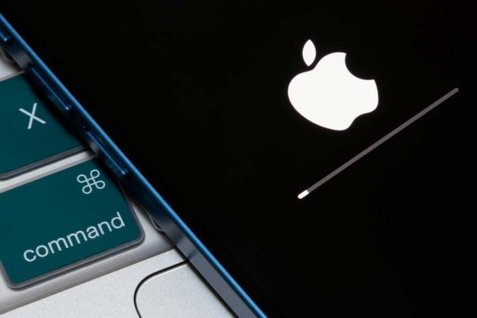 Portland,,Or,,Usa,-,Apr,19,,2023:,Closeup,Up,Of Apple logo displayed on a black screen with a loading bar