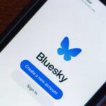 Mobile phone displaying the Bluesky app login screen