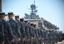 Betrayal Alert: Navy Vet, ISIS, Drones Navy personnel marching in formation towards a ship