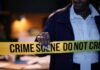 Chilling 911 Line Precedes Hollywood Stabbing Police officer holding crime scene tape