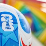 Close-up of a FIFA World Cup soccer ball with a colorful background