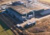 Aerial view of a large industrial facility with various structures and equipment