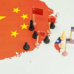 China Squeezes, Trump Stalls — $14B On Ice Map with chess pieces and flags on China