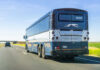 Airline Crew Bus FLIPS — Mystery Deepens Rear view of a blue intercity coach bus on a highway