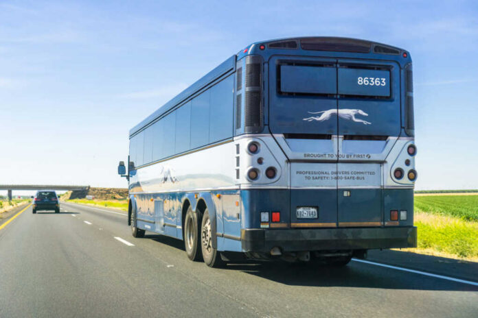 bus-driving-north1113499007jpg Rear view of a blue intercity coach bus on a highway