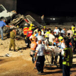 Emergency responders at the scene of a vehicle crash.