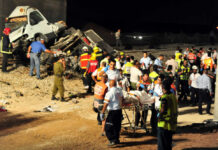 Emergency responders at the scene of a vehicle crash.