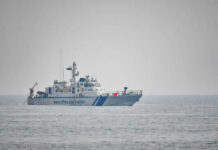 IRAN GUNFIRE Halts India-Bound Ships Coast guard ship on calm ocean waters