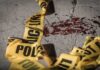 Festival Gunfight Turns Deadly Chaos Crime scene tape near blood on pavement