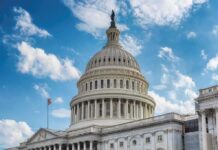 United States Capitol dome under a partly cloudy sky