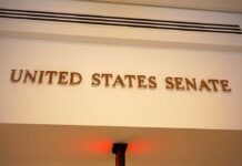 DSA’s Power Play: Senate On The Chopping Block Sign displaying United States Senate in a government building