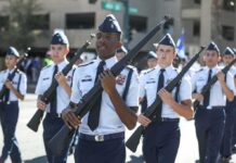 Mystery Illness Swamps Cadet Academy cadets marching in formation with rifles
