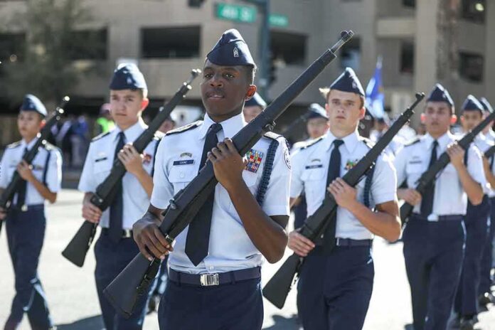 cadets marching in formation with rifles