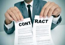 FBI Probes Blockbuster-Backed Money Mirage Person in suit tearing a contract in half