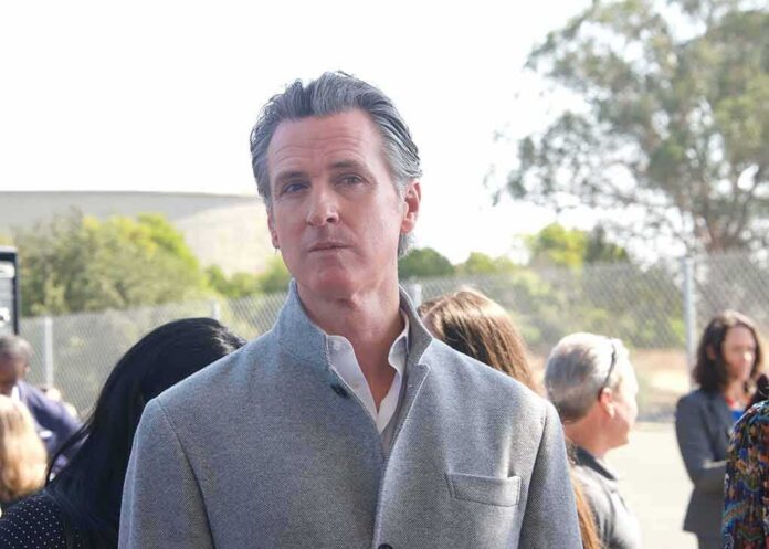 shutterstock_2203551963 man in gray coat at an outdoor event