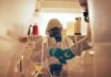 Why America Sends Ebola To Germany Scientists in protective gear conducting an experiment in a laboratory