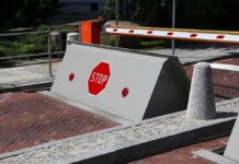 Rising road blocker with stop sign at a security checkpoint