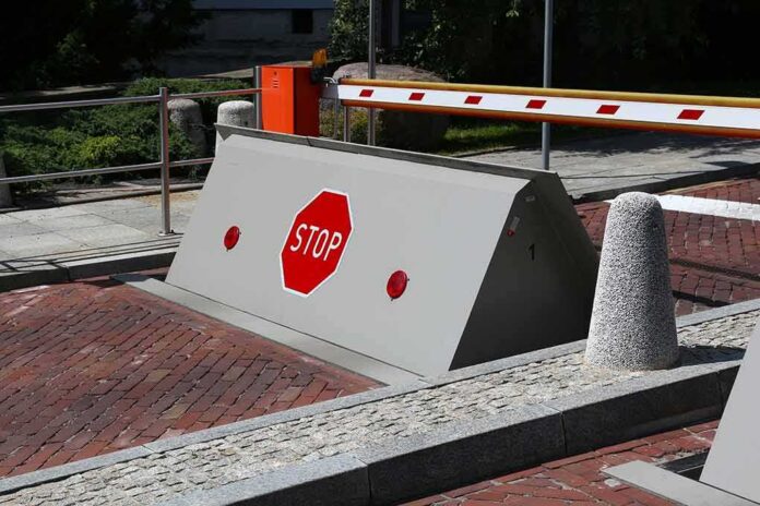 Rising road blocker with stop sign at a security checkpoint