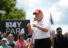 Midnight Barrage Hijacks July 4 Man in red cap and white golf shirt gesturing at a golf event