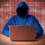 FBI Nukes China’s Hacker Pipeline Hooded figure using a laptop