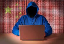 FBI Nukes China’s Hacker Pipeline Hooded figure using a laptop