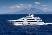 Billionaire Yacht Misses Coast Guard Call Luxury motor yacht cruising on blue sea with mountains in background
