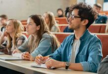 Students listening in a university lecture hall