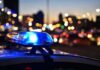 Police car light bar flashing at dusk