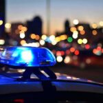 Police car light bar flashing at dusk