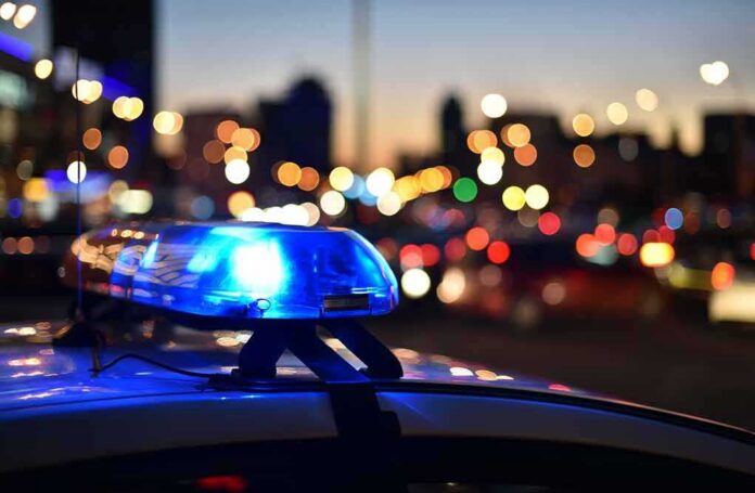 shutterstock_1164796372-1 Police car light bar flashing at dusk
