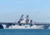 Turkey vs. Israel: Collision Course? Aircraft carrier sailing on calm blue water