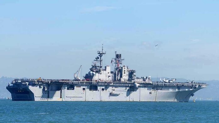 shutterstock_1196717440-5 Aircraft carrier sailing on calm blue water