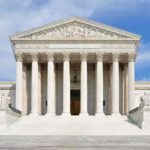 Jeffries Targets Supreme Court Power Front view of the Supreme Court building with large columns and steps under a blue sky
