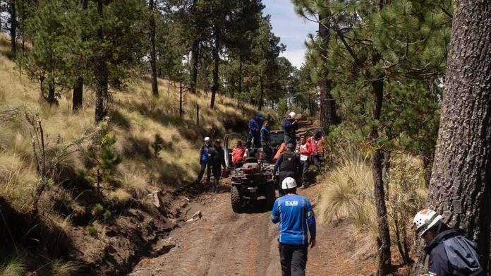 shutterstock_1397004032-5 rescue team with ATVs on a forest trail