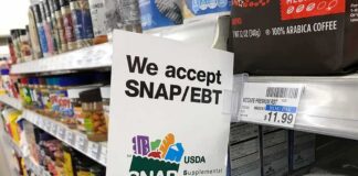 Shelf sign in a grocery aisle showing SNAP EBT acceptance