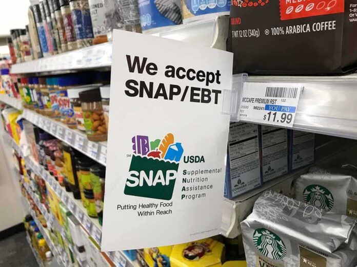 shutterstock_1476926681-4 Shelf sign in a grocery aisle showing SNAP EBT acceptance