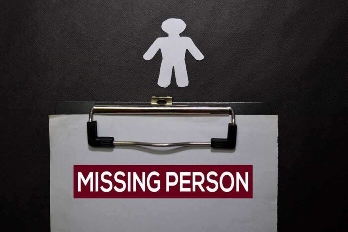 shutterstock_1612428016-1 clipboard with missing person notice and paper cutout figure