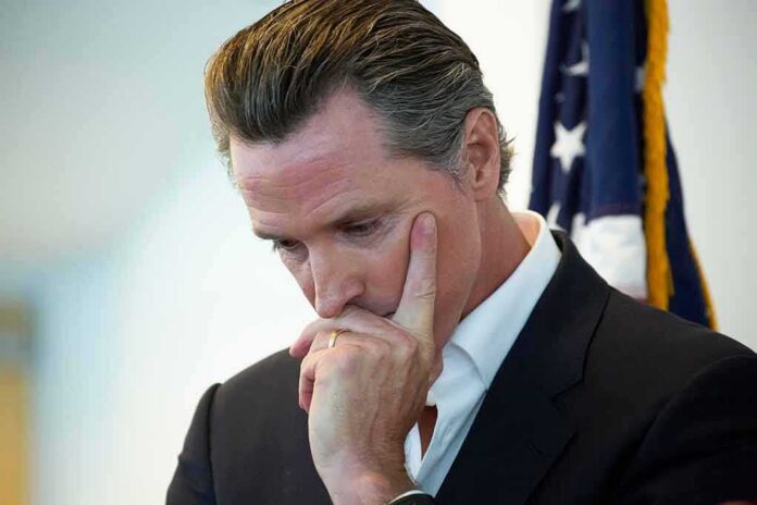 man in suit touching his face thoughtfully