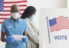 Voters wearing masks at a polling station