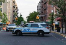 Announcement Backfires: NYPD Calls Bluff NYPD police SUV blocking a city street at a taped-off scene