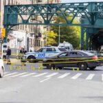 Manslaughter Charge Stuns DC: Kid Suspect Police cars block a city intersection with yellow crime scene tape