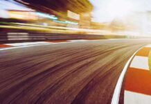 race track curve at sunset with motion blur