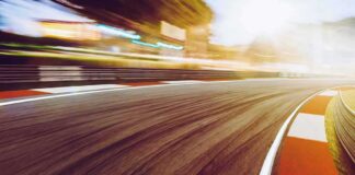 race track curve at sunset with motion blur