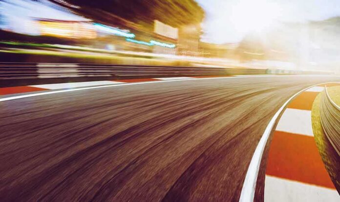 race track curve at sunset with motion blur