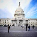 United States Capitol building with visitors on the plaza