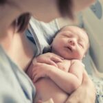Hospital Inferno Kills Newborns newborn baby sleeping in a parent's arms