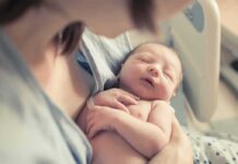 Hospital Inferno Kills Newborns newborn baby sleeping in a parent's arms