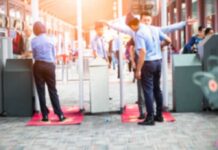 City Hall Vs. NYPD: Who Lied? Security officers screen people at walk-through metal detectors